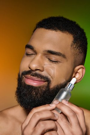 Photo for African american handsome man holds serum. - Royalty Free Image