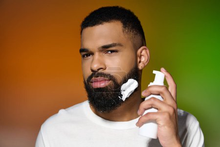 Photo for African american good looking man using shaving cream. - Royalty Free Image