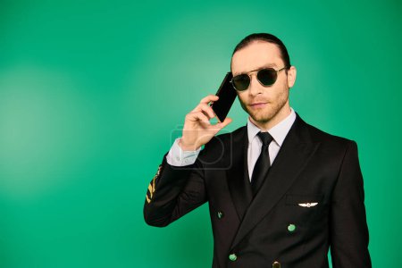 Photo for Stylish man in suit and sunglasses making a call. - Royalty Free Image