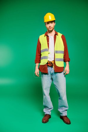 A worker in safety gear with tools on a green backdrop.