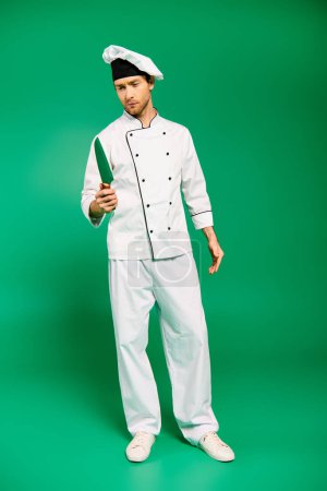 A charismatic male chef in white uniform confidently brandishing a knife.