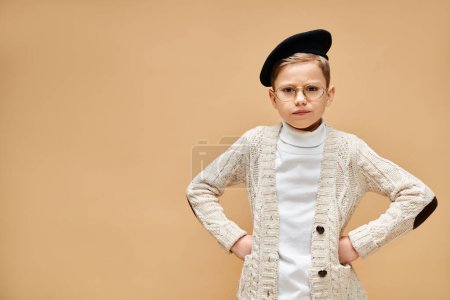 Photo for A young boy in a white sweater and black hat. - Royalty Free Image