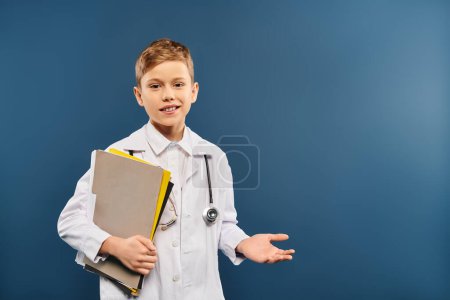 A boy in a lab coat holding a binder in a scientific setting.
