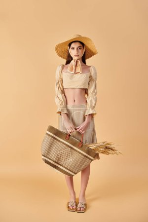 A young woman with long brunette hair wearing a straw hat, holding a basket, embodying a serene summer mood.