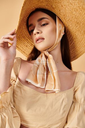 A young woman with long brunette hair strikes a stylish pose wearing a hat and scarf, exuding a summery vibe.
