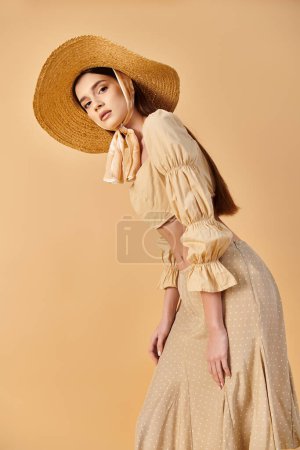 Young brunette woman strikes a pose in a flowing dress and hat, exuding a carefree summer vibe.