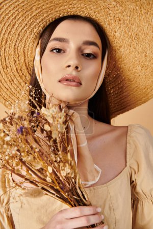 A young brunette woman exudes summer vibes as she holds a bouquet of colorful flowers in a stylish straw hat.