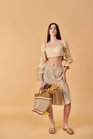 A young woman with long brunette hair poses confidently in a crop top and skirt, holding a basket with a summer vibe.