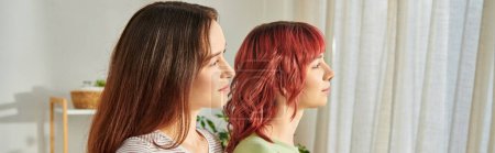 banner of young lesbian couple embracing while looking away, their faces full of bliss and love