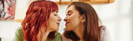 happy lesbian couple going to kiss each other while having cozy and sweet moment at home, banner