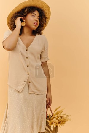 A beautiful young African American woman with curly hair wearing a summer dress and hat