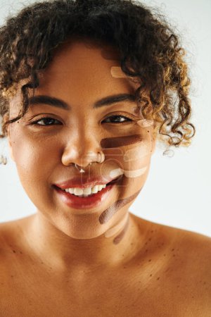 Photo for African American woman with makeup, smiling happily. - Royalty Free Image