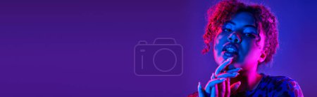 Photo for A vibrant African American woman passionately posing. - Royalty Free Image