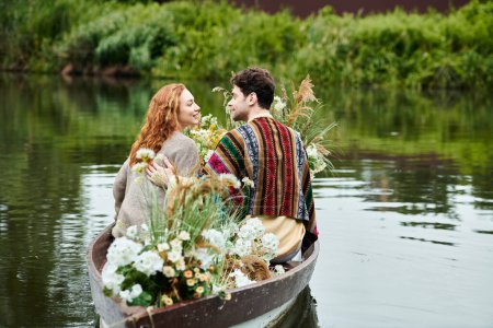 A romantic couple, dressed in boho style clothes, peacefully sail in a boat adorned with flowers in a lush green park setting.