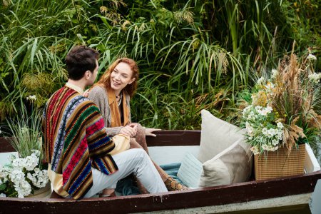 A man and a woman peacefully seated in a boat, surrounded by the beauty of nature on a romantic date in a green park.