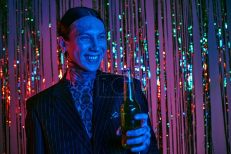 Photo for Business man in suit and tie holding a beer - Royalty Free Image