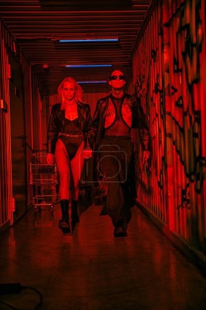 Photo for Two people, a couple, walking together down a hallway - Royalty Free Image
