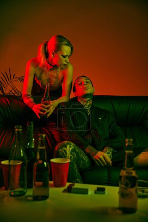 Photo for Woman and man seated together on a couch - Royalty Free Image