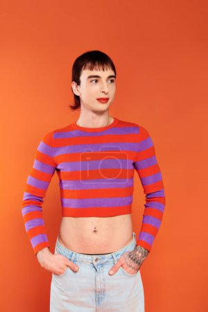 Photo for Joyous attractive stylish gay man with vibrant makeup in modish casual outfit, pride month - Royalty Free Image