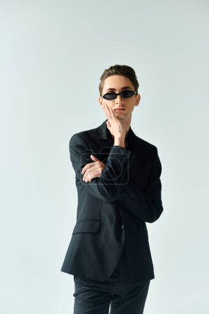 Foto de A young person exudes confidence and pride, styled in sleek fashion. - Imagen libre de derechos