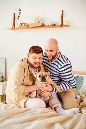 Man tenderly holds small bulldog on bed in cozy home setting.