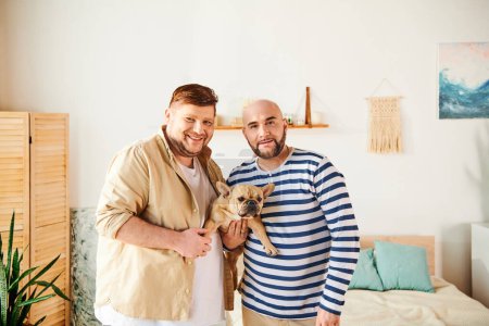 Gay couple standing together, holding their French Bulldog.