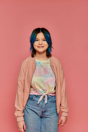 Téléchargez les photos : A girl with blue hair stands confidently in front of a bright pink wall. - en image libre de droit