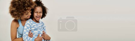 Photo for Two children, hugging each other tenderly in front of a white background, showcasing pure and unconditional affection. - Royalty Free Image