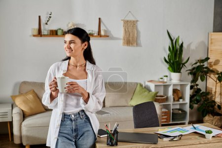 Elegant woman enjoying coffee in a warm living space.