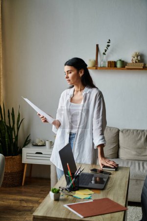 Stylish woman reviewing paperwork in cozy home office setting.