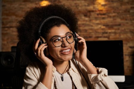 A young woman wearing headphones in a recording studio, immersed in music production for a band rehearsal session.
