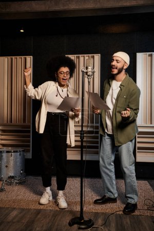 A man and woman passionately sing together in a recording studio during a music band rehearsal.