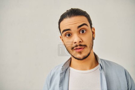 Photo for A man making a funny face against a white background. - Royalty Free Image
