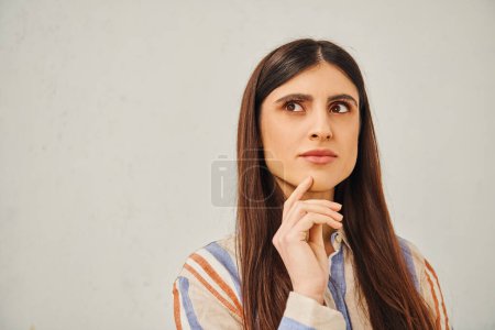 Photo for A stunning woman with long hair looking away. - Royalty Free Image