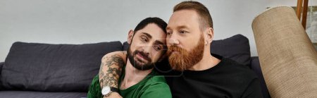 A gay couple in love sits closely on a couch, symbolizing a fresh start in their new home.
