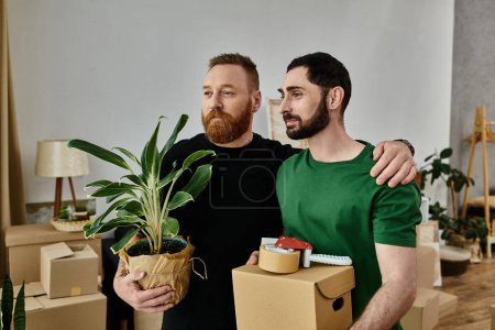 Foto de Pareja gay abraza en frente de mover cajas, comenzando nueva vida en su nuevo hogar. - Imagen libre de derechos