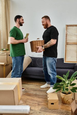 A gay couple exploring their new living room surrounded by packed boxes, beginning a new chapter together.