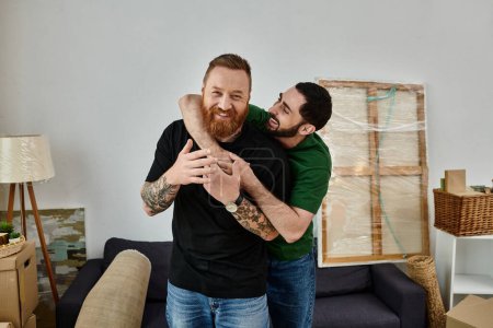 Two men hug in a cozy living room, celebrating their love and new chapter together.