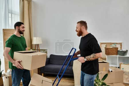 Foto de Two men, a gay couple in love, transport and set up boxes in their living room for their new chapter in life. - Imagen libre de derechos