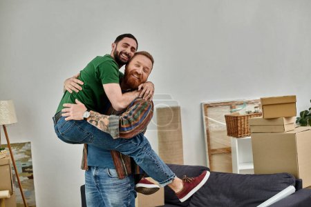 Two men embracing in a room filled with moving boxes, symbolizing a new chapter in their lives as a gay couple in love.