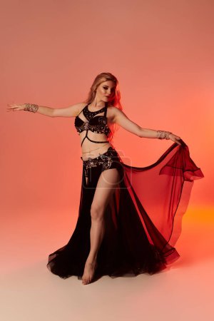 Elegantly dressed woman performs a captivating belly dance.