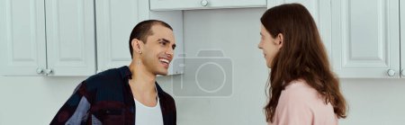 Photo for A gay couple, are standing together in a warm kitchen, bonding over cooking and sharing moments of joy. - Royalty Free Image
