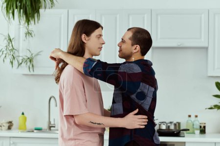 Photo for A gay couple in casual clothes enjoy hugging together in a vibrant kitchen setting. - Royalty Free Image