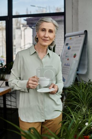 Mature woman enjoying a hot cup of coffee.