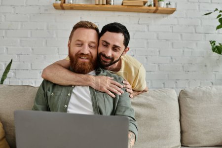 Two bearded men hug while poring over a laptop in their cozy living room, sharing a moment of closeness and togetherness.