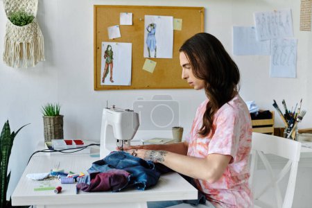 A young man sews on a vintage sewing machine in his home studio, surrounded by colorful fabrics and inspiration.