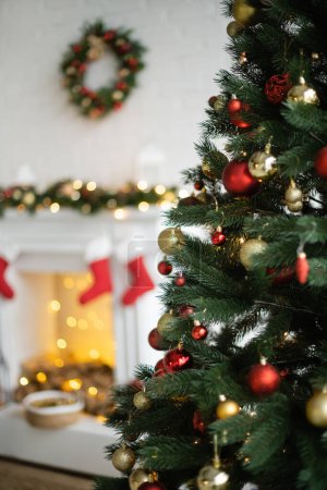 Decorated christmas tree in blurred living room 