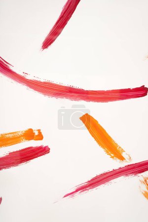 Foto de Top view of abstract colorful paint strokes on white background - Imagen libre de derechos