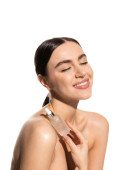 happy young woman with bare shoulders and closed eyes holding bottle with moisturizing serum isolated on white  hoodie #642937252
