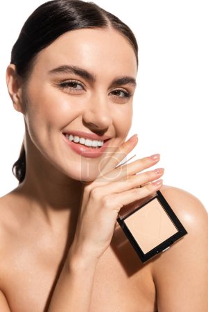 happy young woman with bare shoulders holding neutral beige face powder isolated on white  Mouse Pad 642938276